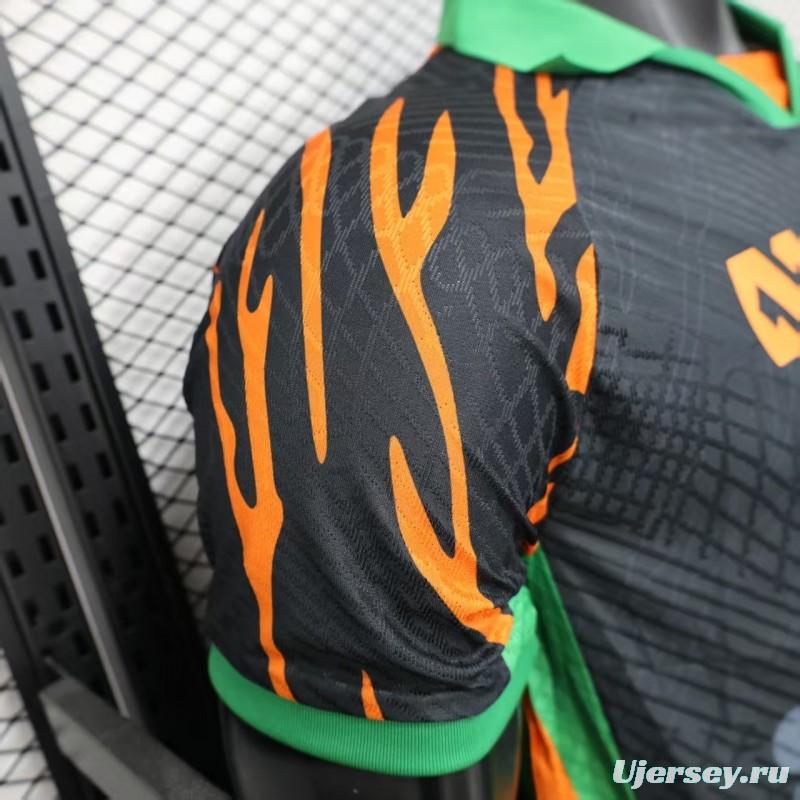 Player Version 2025 Ivory Coast Black with Elephant Graphic and Orange Stripes Jersey