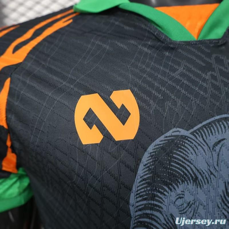 Player Version 2025 Ivory Coast Black with Elephant Graphic and Orange Stripes Jersey